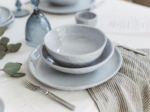 simple gray dinner set consists of plate and two bowls